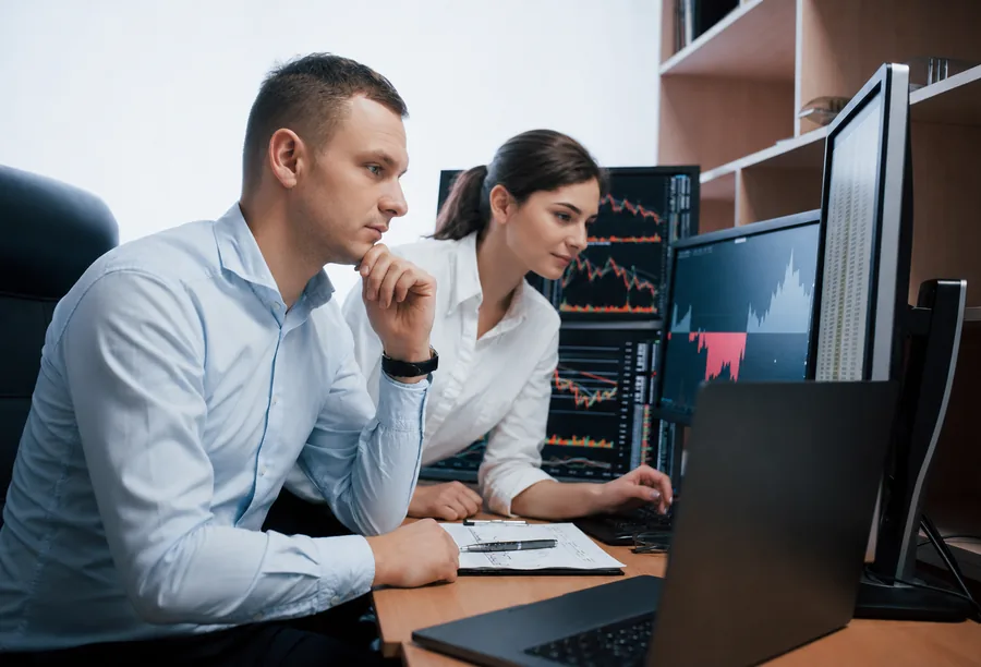 global-advisers-investment-team-reviewing-market-data